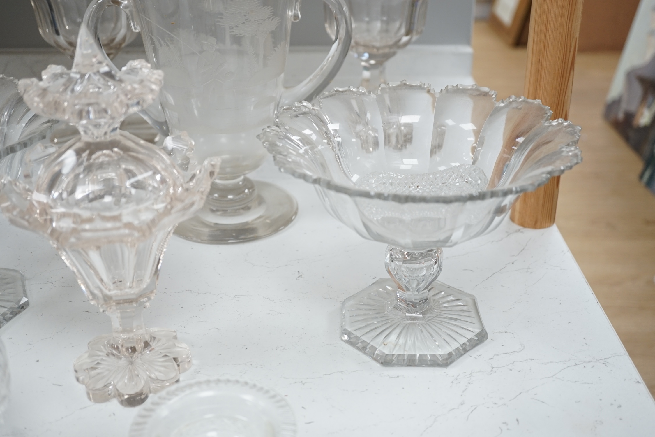 19th century and later glassware to include a pair of glass confitures (one cover), a twin handled etched cup, etc. largest 38cm high. Condition - fair